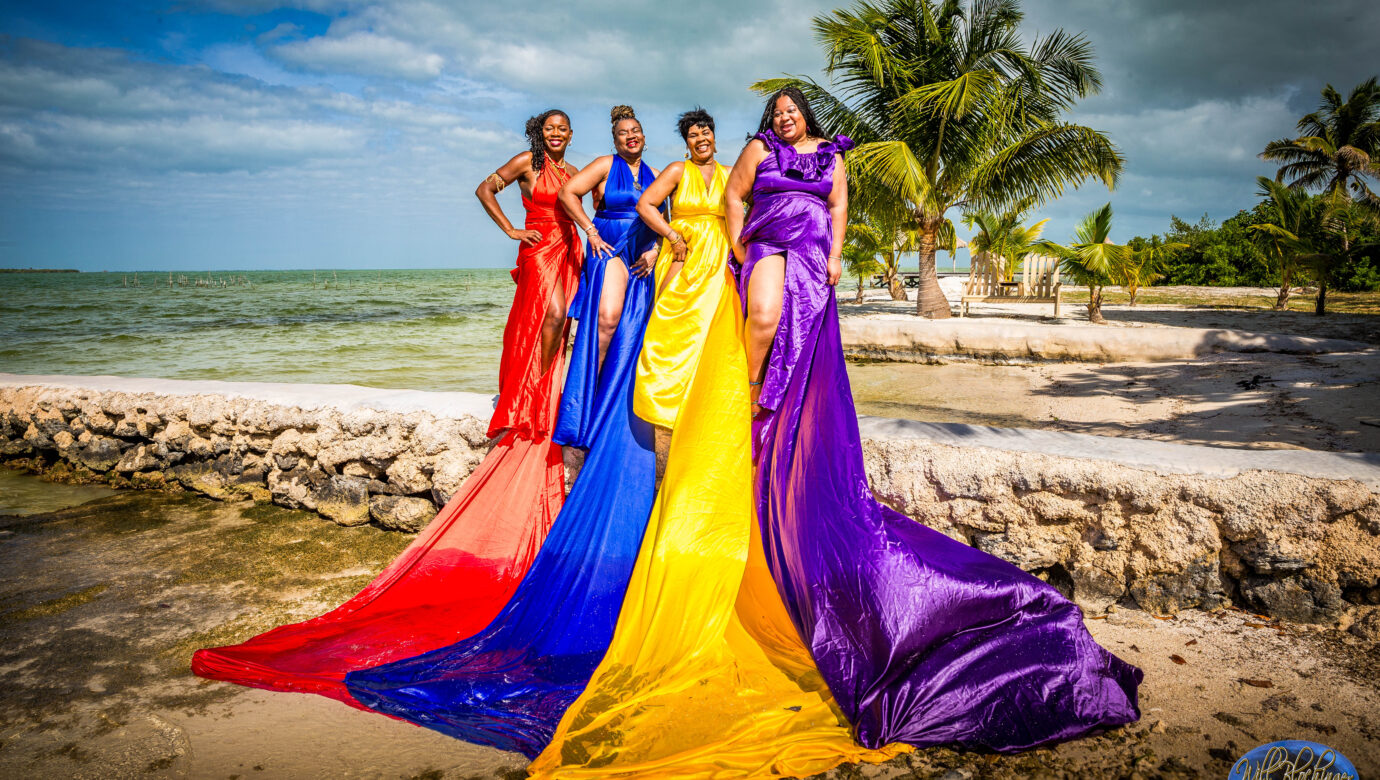 group of women getting flying dress photography done by san pedro belize photographer in ambergris caye